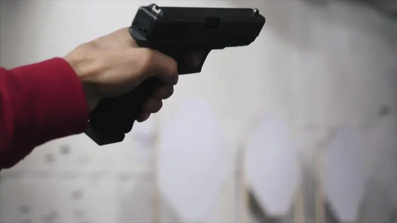 gun-is-shot-close-up-pistol-in-hand-close-up-pistol-being-shot-1-times-man-shoots-a-black-gun-video