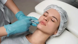 high-angle-woman-getting-lips-injection-scaled